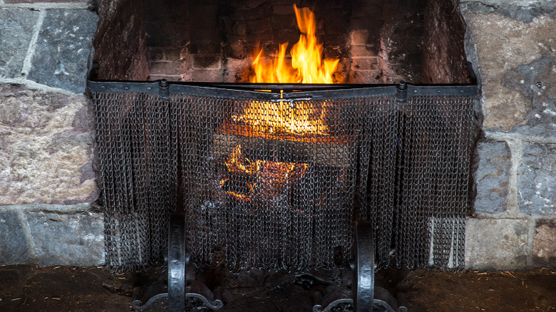 roaring fire in stone fireplace
