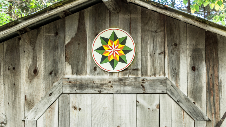 colorful hex sign on barn