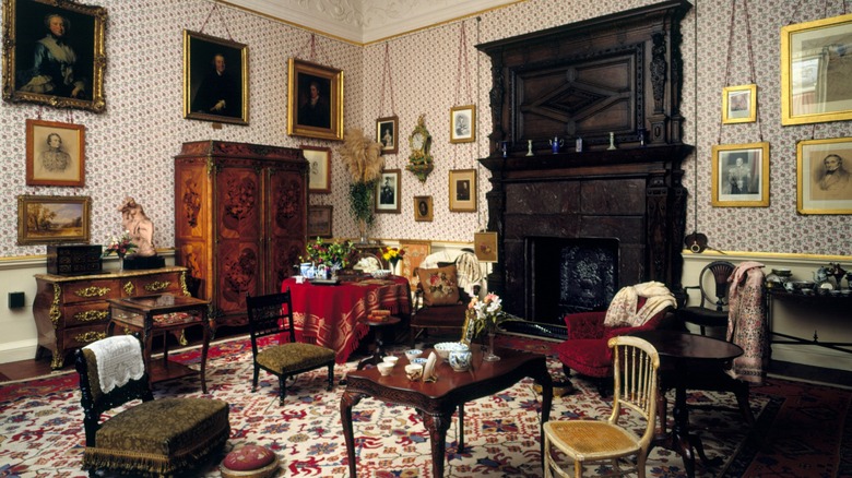 A cluttered Victorian drawing room