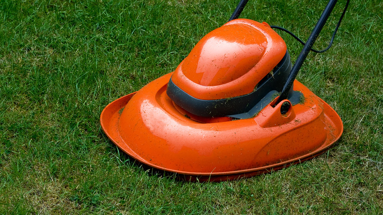 orange hover mower on grass